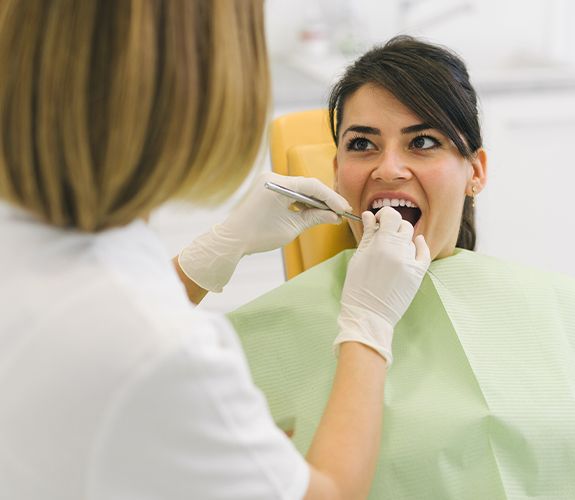 Woman receiving treatment for periodontal disease