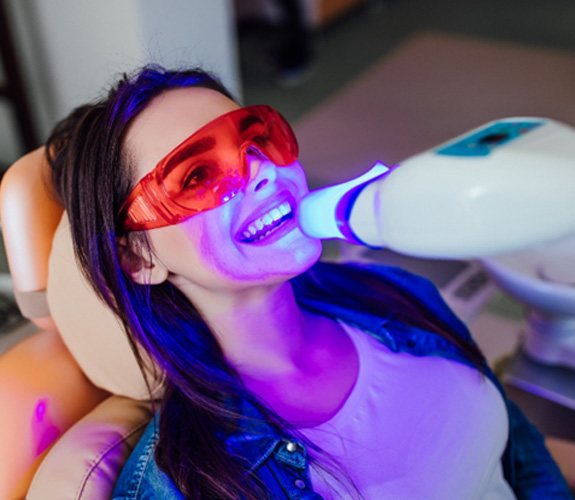 A young woman getting in-office teeth whitening