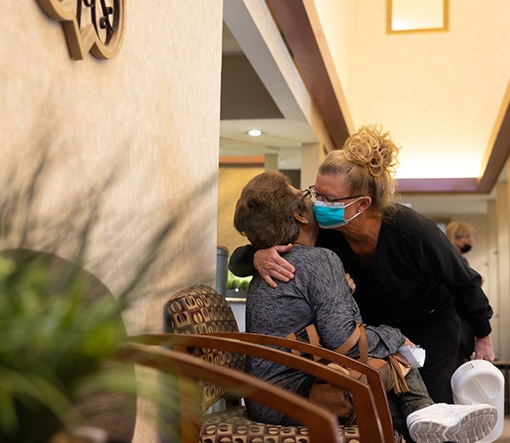 Smiling mother daughter and granddaughter after whole family dental visit