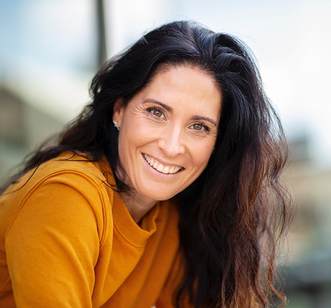 A beautiful woman smiling outdoors