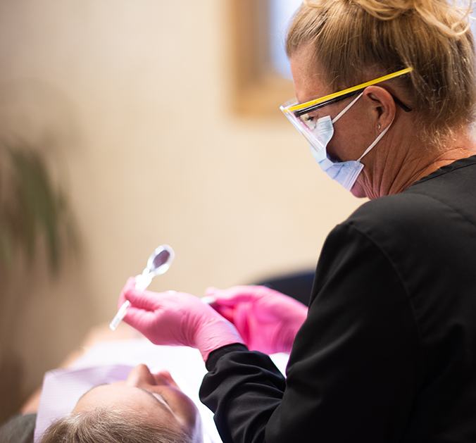 Family with healthy smiles after dental checkups and teeth cleanings