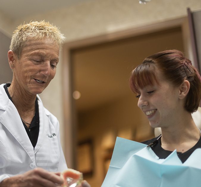 Dr. Christine Root with dentures in Marion