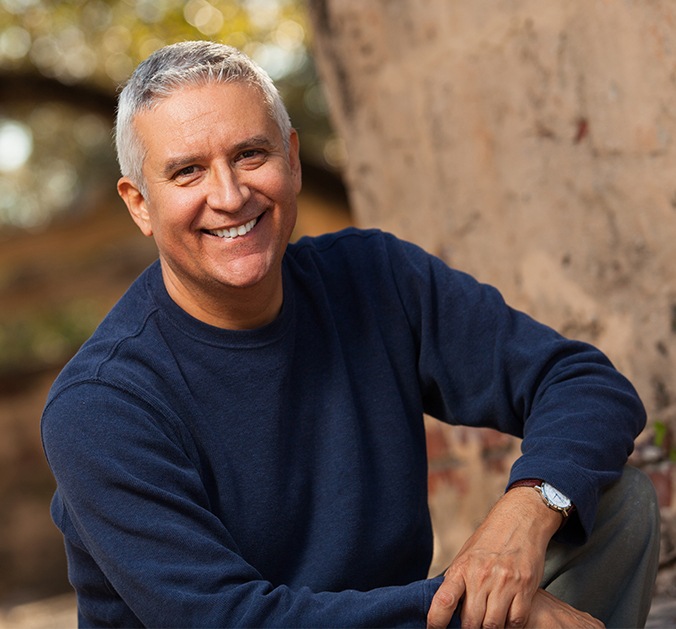 Man with healthy smile after tooth extraction