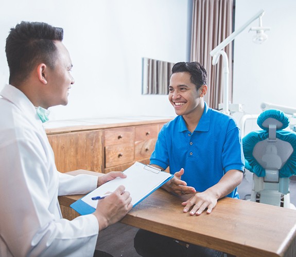 patient talking to dentist 