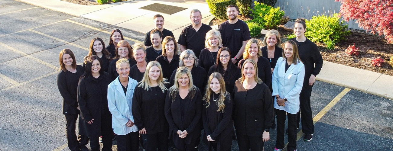 Three friendly dental team members