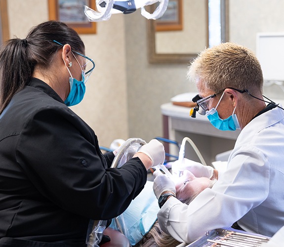 Dentist discussing dental insurance coverage for treatment plan