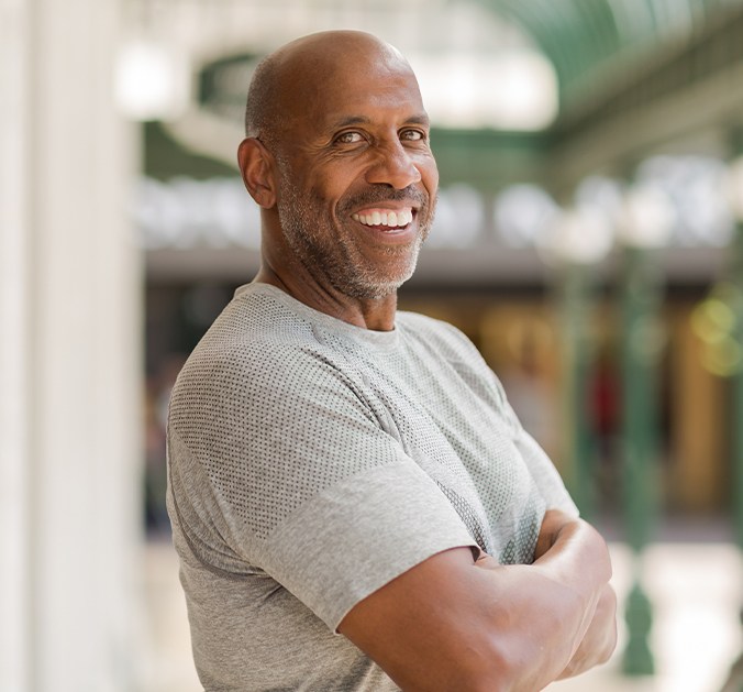 Man sharing healthy smile after replacing missing teeth