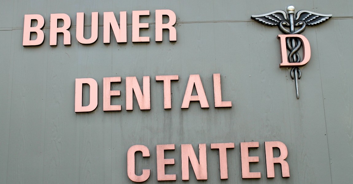 Bruner Dental sign on the side of the dental office building
