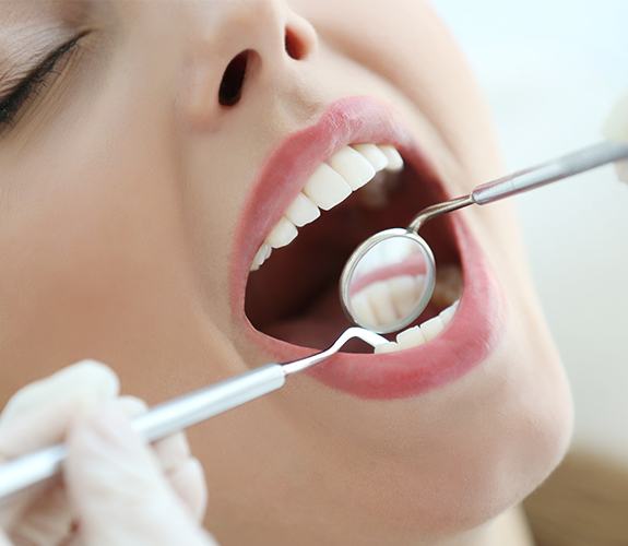 Patient receiving oral cancer screening