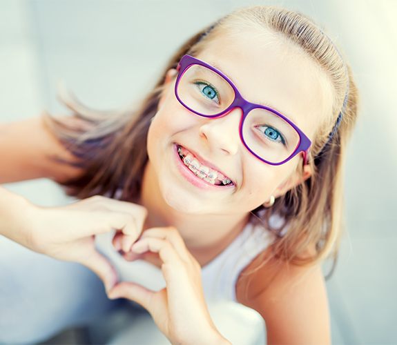 Young girl with traditional braces