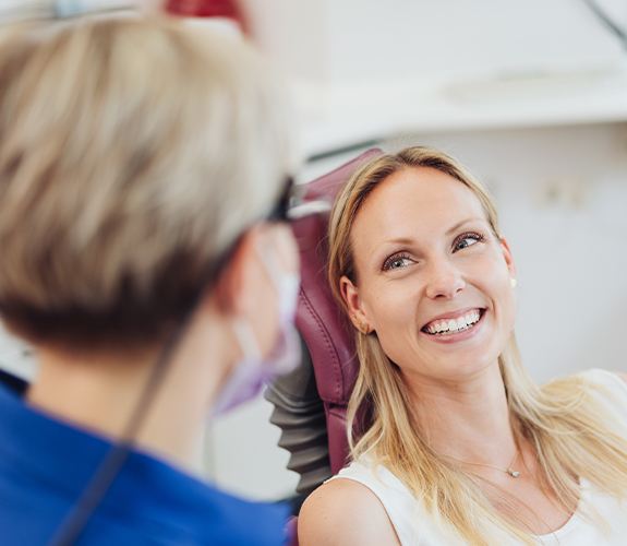 Patient discussing periodontal disease treatment options with dentist