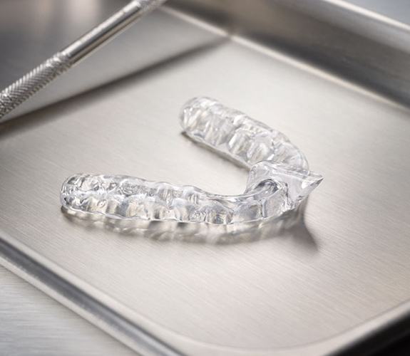 Clear nightguard for bruxism on metal tray