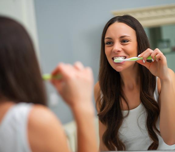 Woman brushing her teeth