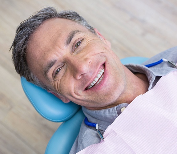 Man smiling after root canal therapy