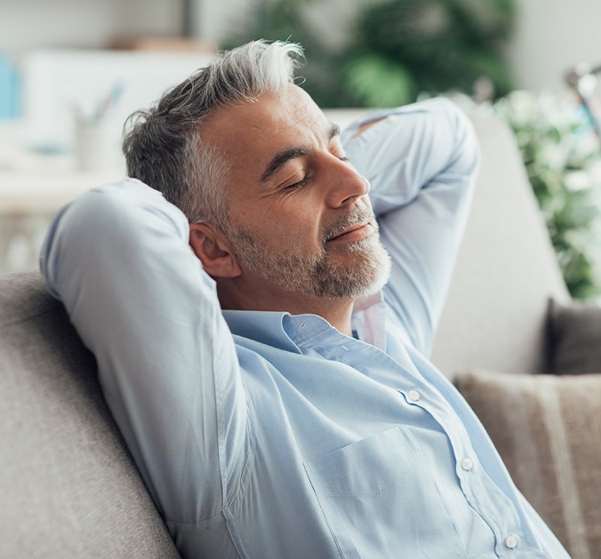 Man relaxing after sedation dentistry visit