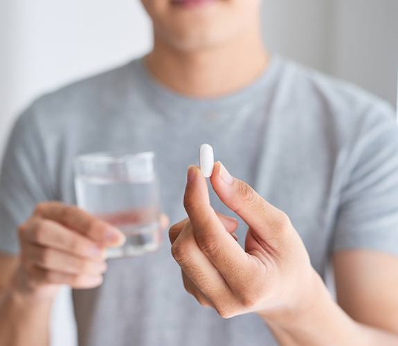 Patient taking oral conscious dental sedation pill