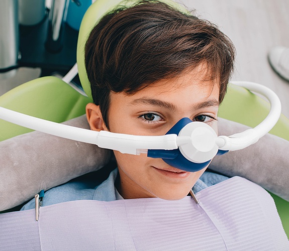 Teen boy with nitrous oxide dental sedation mask