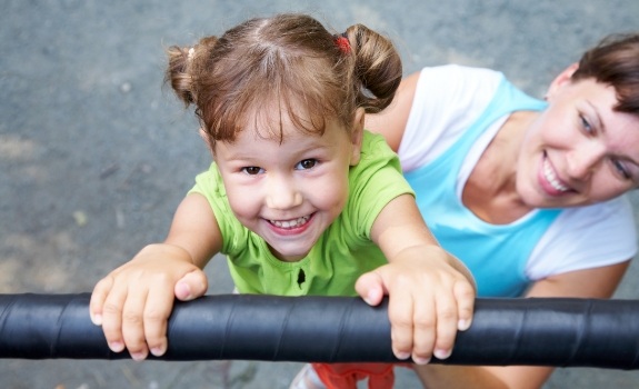 Child on playground after children's dentistry visit