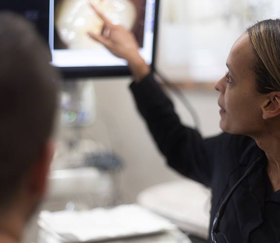 Dentist using intraoral camera to capture smile images