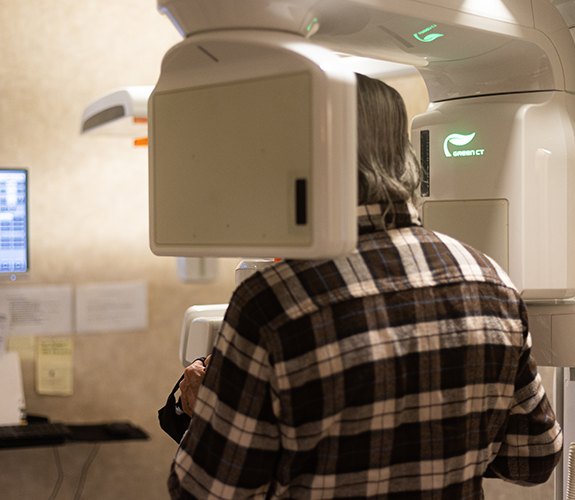 Woman receiving C T cone beam x-ray scans