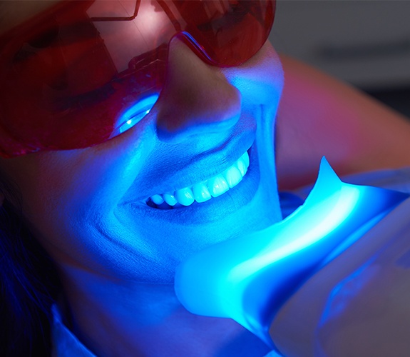 Patient receiving in office teeth whitening treatment