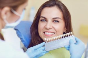 dentist matching patient's teeth color