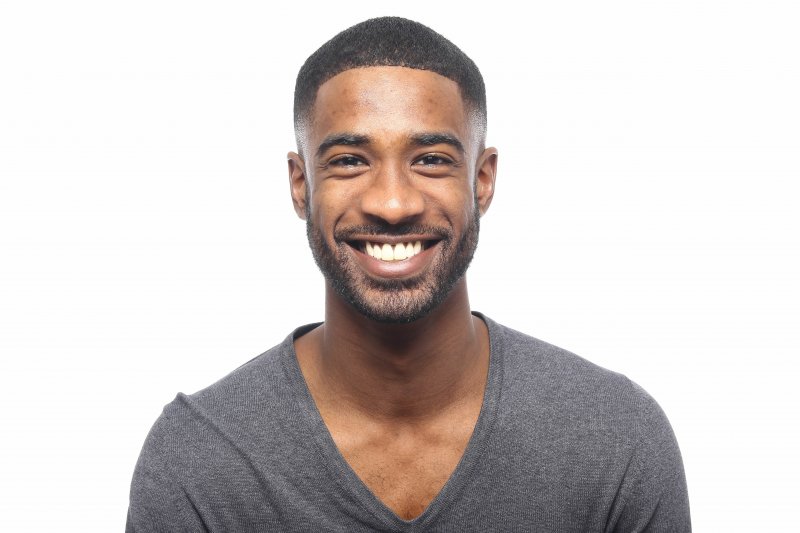 person with porcelain veneers smiling