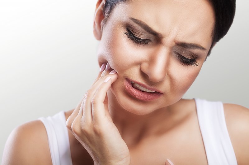 Close up on the mouth of a woman suffering from a toothache